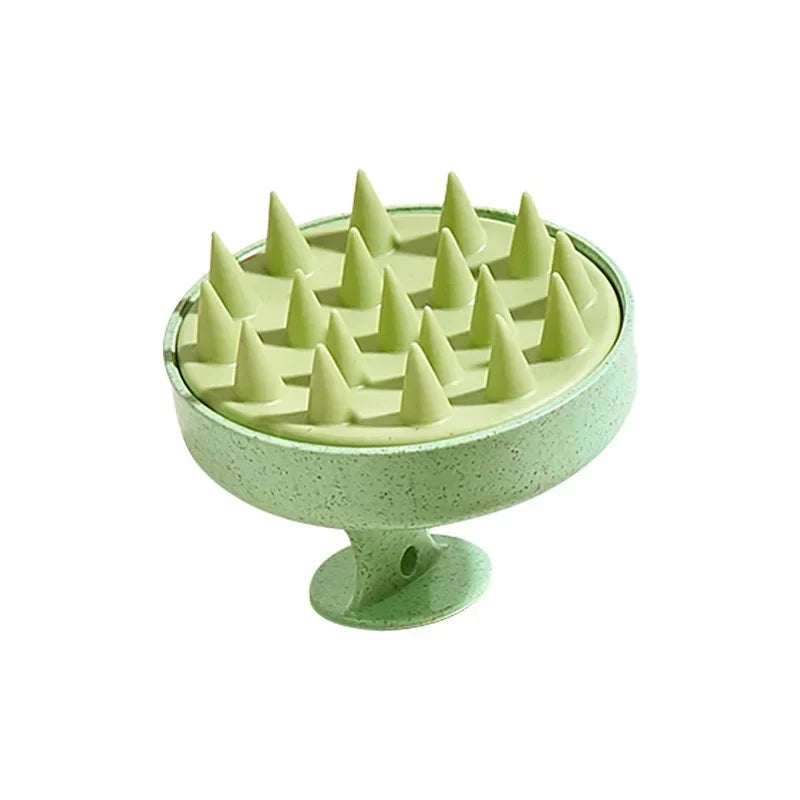green scalp massager on white background
