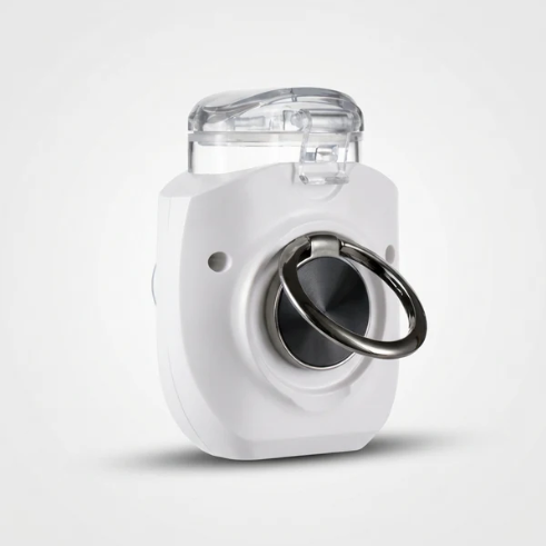 A white and clear handheld nebuliser shown from the back