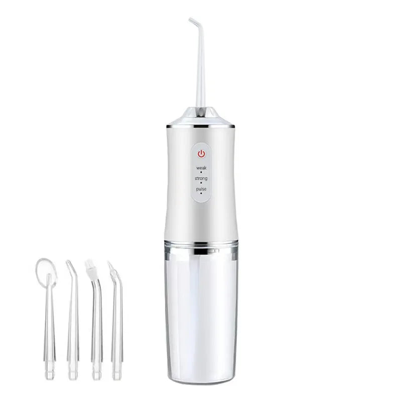 White dental water flosser with additional nozzles on a white background